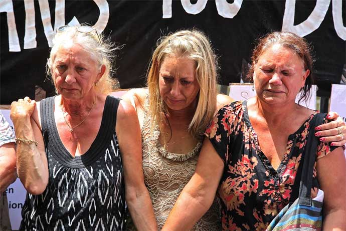 Members of Grandmothers Against Removals protesting against the overrepresentation of Indigenous children in the child-protection system on the steps of the parliament house of New South Wales in Sydney on Feb. 13, 2014