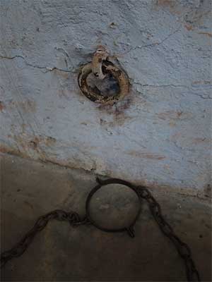 Chain ring in Roebourne gaol. The band on the floor goes around the prisoner's neck.