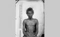 Paul Foelsche, Studio portrait if Aboriginal man, hand chained at right c.1875, Northern Territory