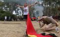 Activist Marianne Headland Mackay calls out to police at Heirisson Island as campsites are dismantled.  (ABC News: Rebecca Trigger)