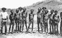 1896: Aboriginal prisoners in chains are photographed outside Roebourne Gaol. 